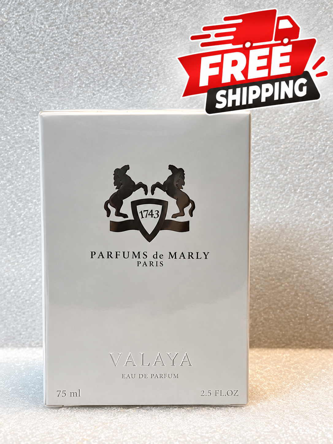 A rectangular box of Parfums de Marly Valaya Eau de Parfum, 75 ml, shown on a textured light gray surface with a red and black 'FREE SHIPPING' graphic overlay in the top right corner.