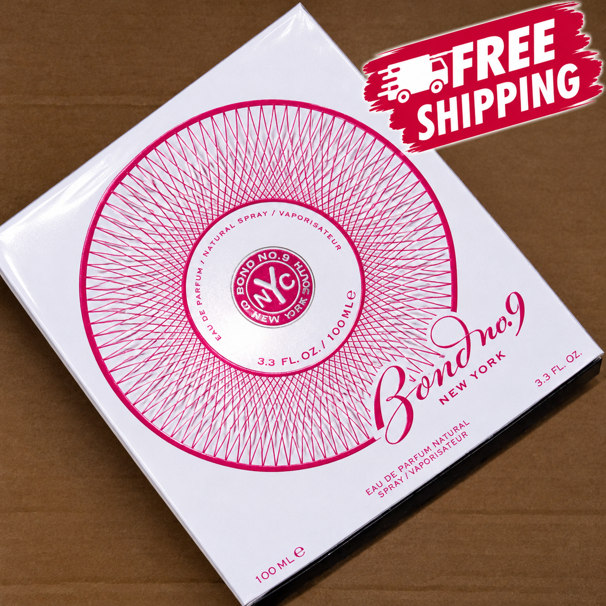 Bond No. 9 New York Eau de Parfum 100ml box on a brown cardboard background, featuring a pink circular design on a white box with a 'FREE SHIPPING' graphic overlay in the top right corner.
